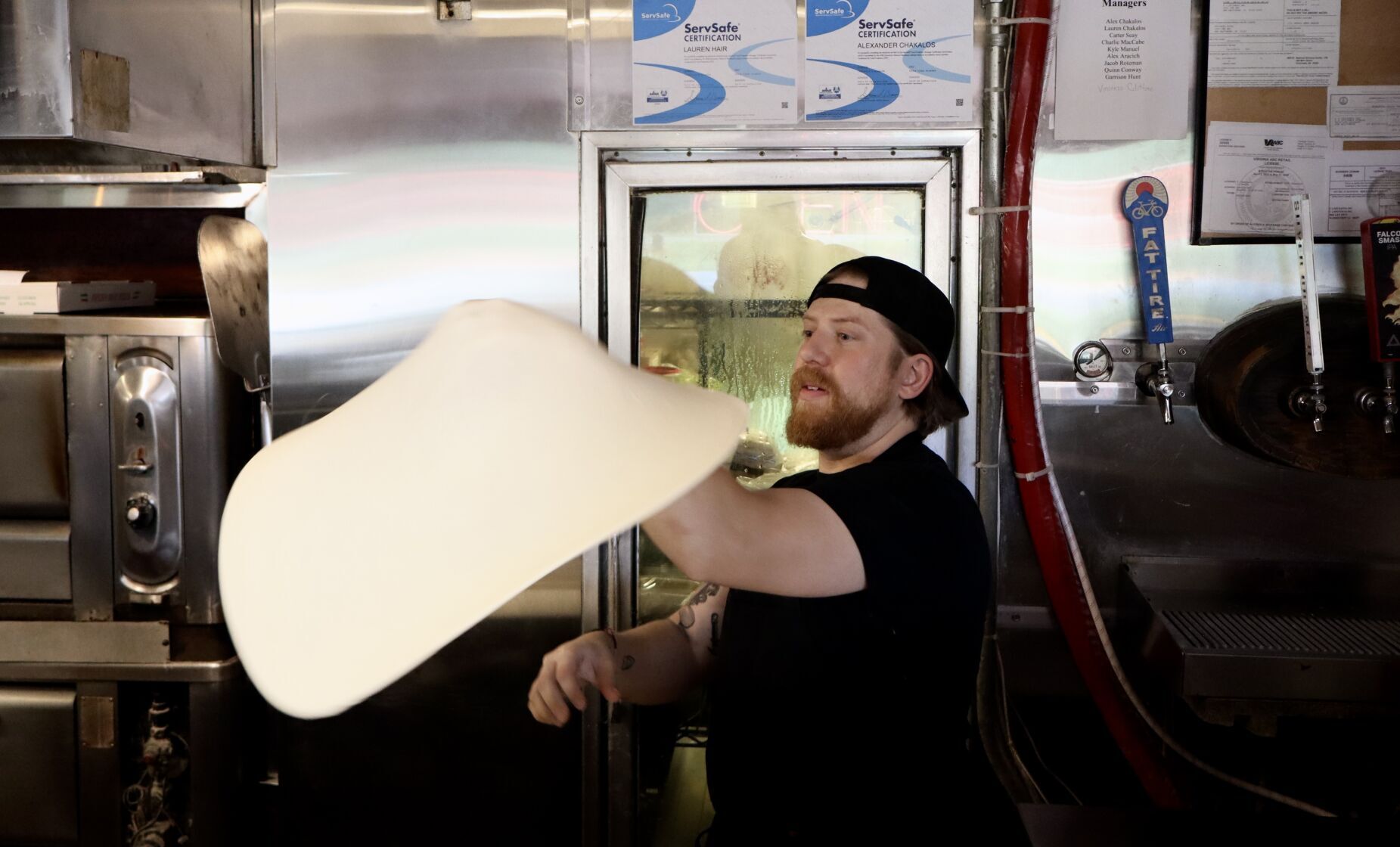 Alex tossing dough